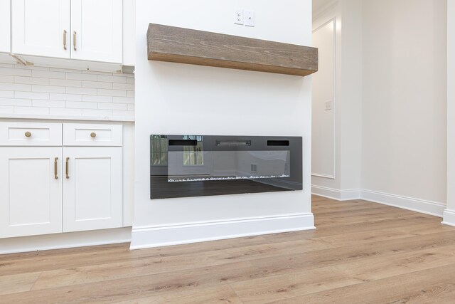 128 Bethany Trce, Lancaster, KY 40444 - detailed view of wood finished floors and backsplash