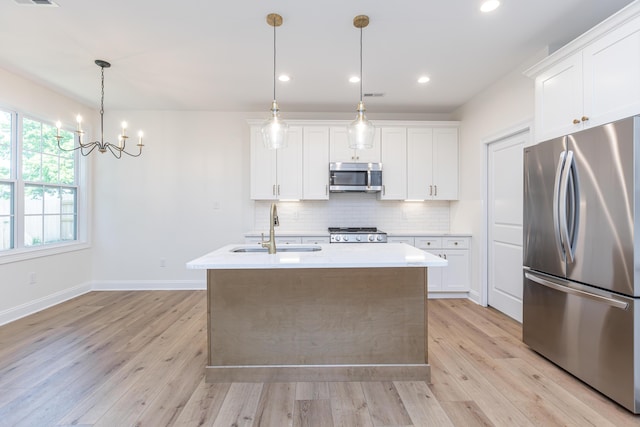 128 Bethany Trce, Lancaster, KY 40444 - kitchen with appliances with stainless steel finishes, light wood-style floors, decorative backsplash, light countertops, and recessed lighting