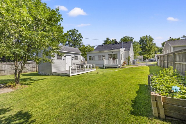 648 Sheridan Dr, Lexington, KY 40503 - fenced backyard featuring a wooden deck and an outdoor structure