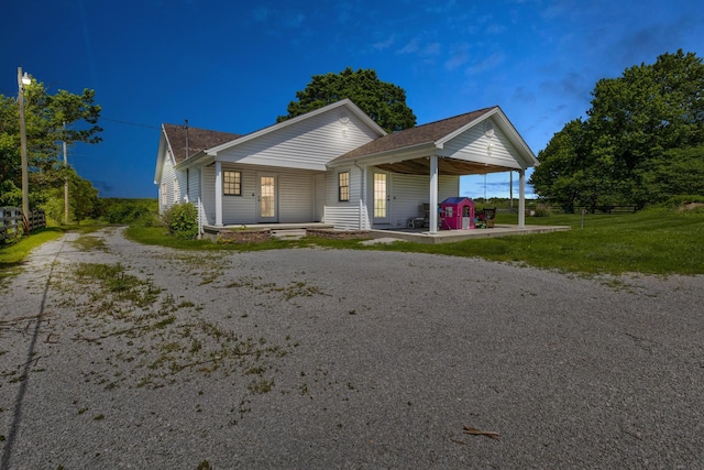 1831 Kiddville Rd, Winchester, KY 40391 - view of front of house with dirt driveway, covered porch, and roof with shingles