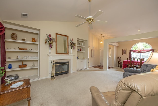 3965 Wyndham Rdg, Lexington, KY 40514 - living room with light colored carpet, built in features, ceiling fan, vaulted ceiling, and a fireplace