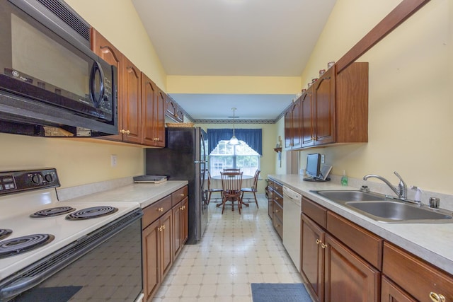 3965 Wyndham Rdg, Lexington, KY 40514 - kitchen with black appliances, light floors, light countertops, pendant lighting, and brown cabinets