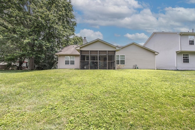 3965 Wyndham Rdg, Lexington, KY 40514 - rear view of house featuring a chimney, a sunroom, and a yard