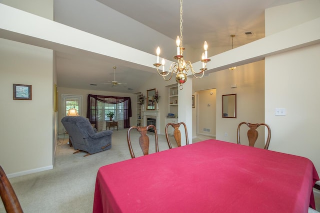 3965 Wyndham Rdg, Lexington, KY 40514 - carpeted dining area featuring ceiling fan, a chandelier, a fireplace, and a high ceiling