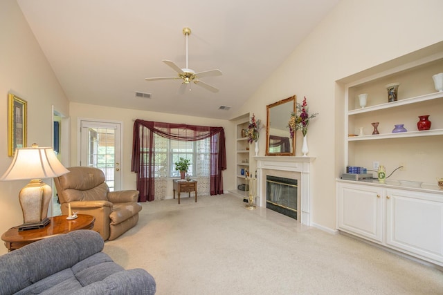 3965 Wyndham Rdg, Lexington, KY 40514 - living room with lofted ceiling, light carpet, ceiling fan, a premium fireplace, and built in shelves