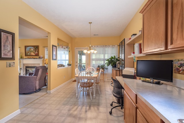 3265 Scottish Trce, Lexington, KY 40509 - home office with light flooring, a chandelier, and a glass covered fireplace