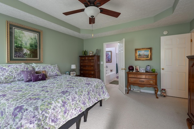 3265 Scottish Trce, Lexington, KY 40509 - bedroom featuring light carpet, a raised ceiling, a textured ceiling, ensuite bath, and a ceiling fan