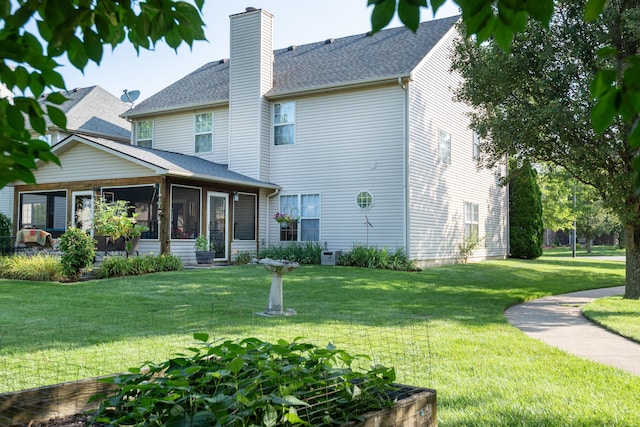 3265 Scottish Trce, Lexington, KY 40509 - view of front facade with a chimney, a sunroom, a front lawn, and a shingled roof