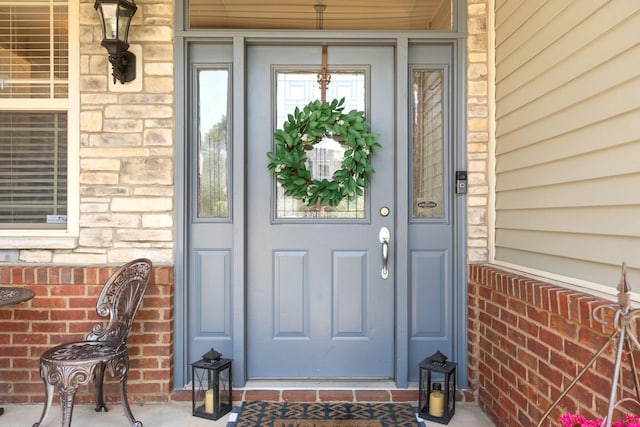 115 Westwoods Dr, Georgetown, KY 40324 - view of exterior entry featuring a porch and stone siding