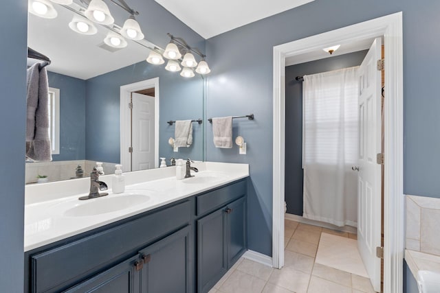 115 Westwoods Dr, Georgetown, KY 40324 - full bathroom with double vanity, tile patterned flooring, and a tub to relax in