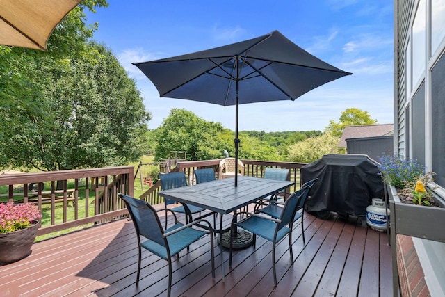 115 Westwoods Dr, Georgetown, KY 40324 - wooden deck with outdoor dining space and a grill