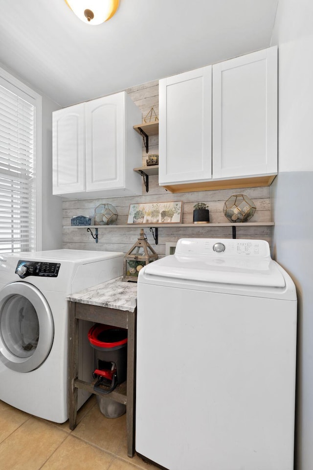 115 Westwoods Dr, Georgetown, KY 40324 - laundry area with cabinet space, light tile patterned floors, and washing machine and dryer