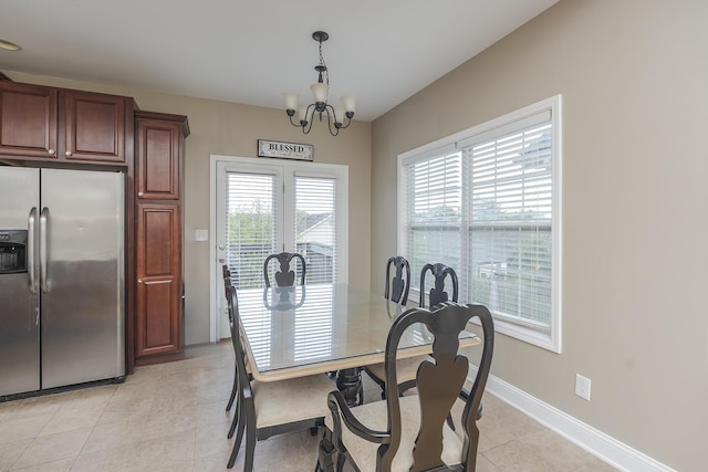 3224 Orchard Grass Rd, Lexington, KY 40509 - dining space with a chandelier and light tile patterned floors