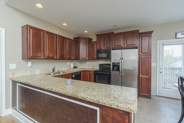 3224 Orchard Grass Rd, Lexington, KY 40509 - kitchen with black appliances, a peninsula, recessed lighting, light stone counters, and light tile patterned floors
