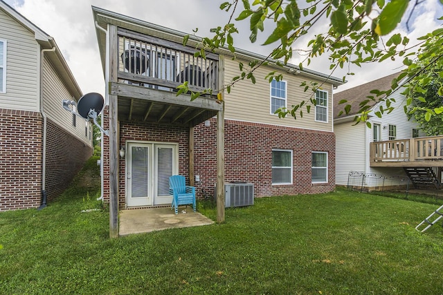 3224 Orchard Grass Rd, Lexington, KY 40509 - rear view of house with a balcony, brick siding, and a lawn