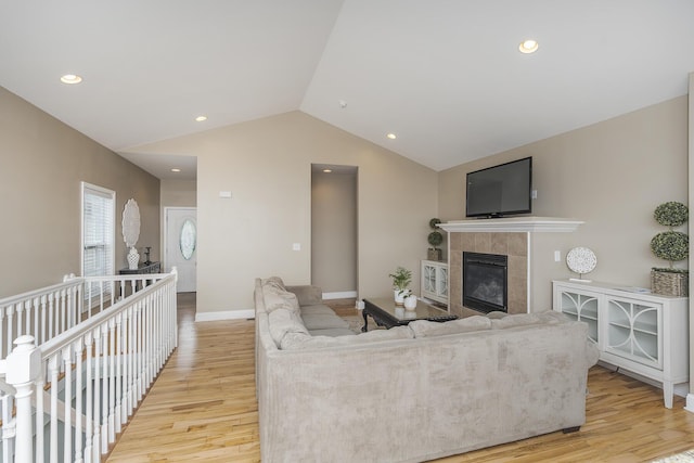 3224 Orchard Grass Rd, Lexington, KY 40509 - living room with light wood finished floors, vaulted ceiling, a fireplace, and recessed lighting