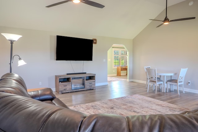 196 Herndon Ln, Berea, KY 40403 - living area with a ceiling fan, light wood finished floors, high vaulted ceiling, and arched walkways