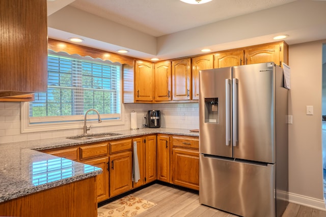 196 Herndon Ln, Berea, KY 40403 - kitchen with stainless steel fridge with ice dispenser, light wood finished floors, light stone countertops, decorative backsplash, and recessed lighting