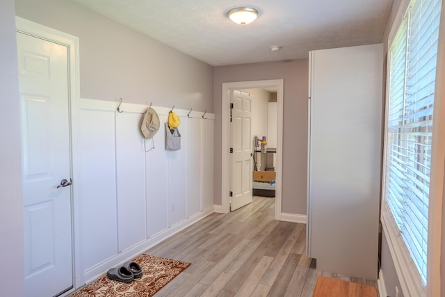 196 Herndon Ln, Berea, KY 40403 - mudroom featuring light wood-type flooring and a textured ceiling
