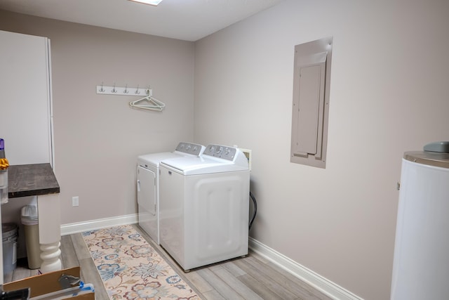 196 Herndon Ln, Berea, KY 40403 - laundry room featuring electric panel, separate washer and dryer, light wood-type flooring, and water heater