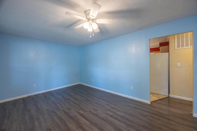 204 Kelly St, Paris, KY 40361 - unfurnished room featuring dark wood-type flooring, ceiling fan, and a textured ceiling