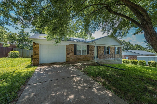 204 Kelly St, Paris, KY 40361 - view of front of house featuring a garage, brick siding, driveway, and covered porch