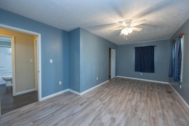 204 Kelly St, Paris, KY 40361 - spare room with light wood-type flooring, a ceiling fan, and a textured ceiling