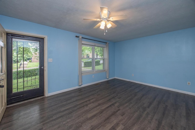 204 Kelly St, Paris, KY 40361 - spare room with dark wood finished floors, ceiling fan, and a textured ceiling