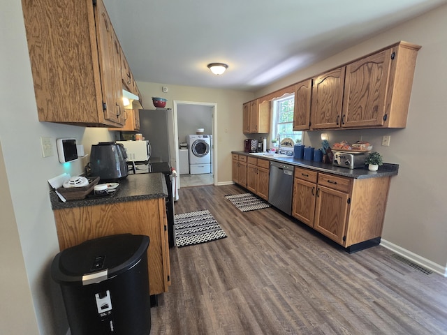 10 Thaxted Ln, Middlesboro, KY 40965 - kitchen featuring stainless steel dishwasher, dark wood-style floors, dark countertops, and separate washer and dryer