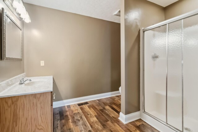 274 Singleton Waynesburg Rd, Eubank, KY 42567 - bathroom with vanity, wood finished floors, and a stall shower