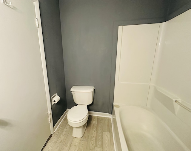 243 Walnut St, Crab Orchard, KY 40419 - bathroom with toilet and wood finished floors