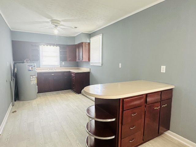 243 Walnut St, Crab Orchard, KY 40419 - kitchen with open shelves, electric water heater, a peninsula, a ceiling fan, and light countertops