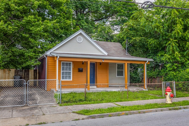 223 Race St, Lexington, KY 40508 - view of front of house featuring covered porch, a gate, and a fenced front yard