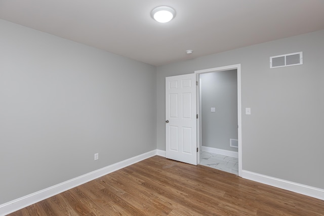 223 Race St, Lexington, KY 40508 - spare room with baseboards and wood finished floors