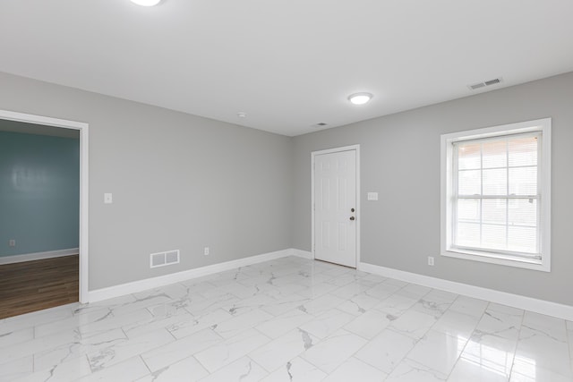 223 Race St, Lexington, KY 40508 - empty room with baseboards and light marble finish flooring