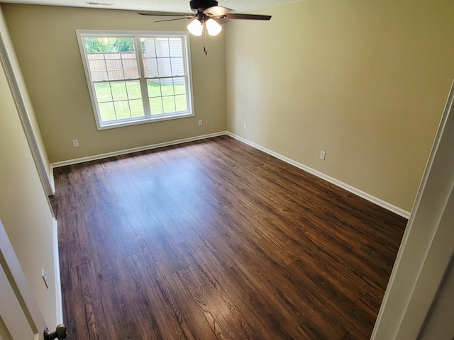 215 Wilderness Cove Ln, Georgetown, KY 40324 - empty room with ceiling fan and dark wood-type flooring