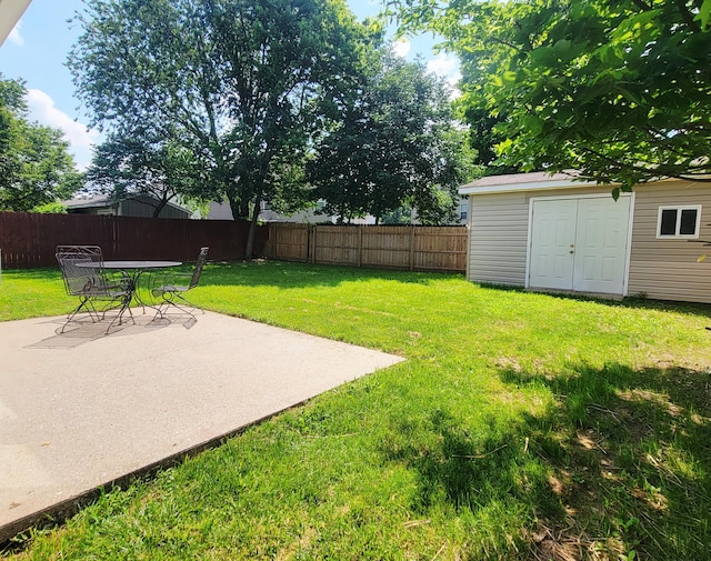 215 Wilderness Cove Ln, Georgetown, KY 40324 - fenced backyard with a patio area and a shed