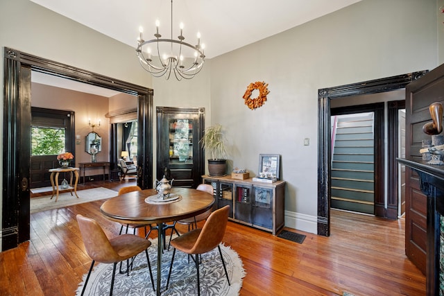 456 N Limestone St, Lexington, KY 40508 - dining room featuring wood-type flooring and a chandelier