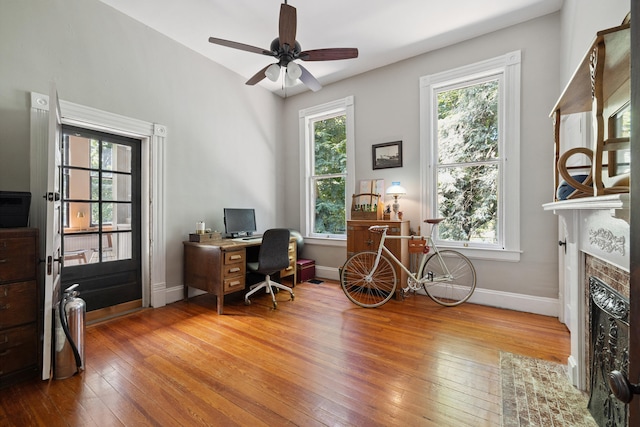 456 N Limestone St, Lexington, KY 40508 - office space featuring hardwood / wood-style flooring, ceiling fan, and a fireplace