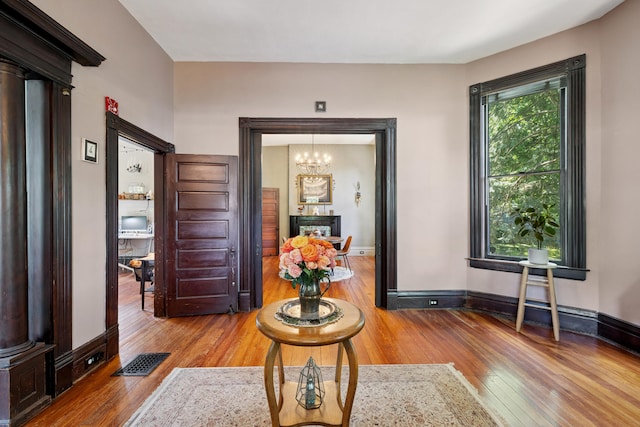 456 N Limestone St, Lexington, KY 40508 - hall with hardwood / wood-style floors and a chandelier