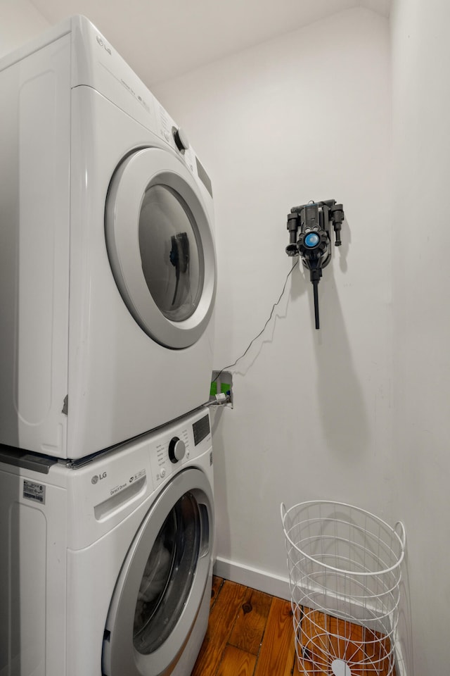 456 N Limestone St, Lexington, KY 40508 - laundry room with stacked washing machine and dryer and dark wood-style floors