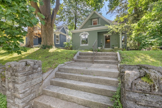 456 N Limestone St, Lexington, KY 40508 - view of front facade with stairway, stucco siding, and a front lawn