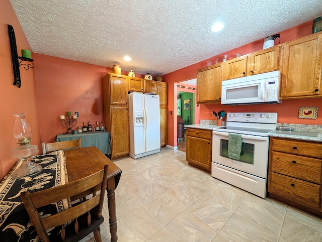 1260 Old Way Rd, London, KY 40741 - kitchen featuring white appliances, light countertops, brown cabinetry, recessed lighting, and a textured ceiling