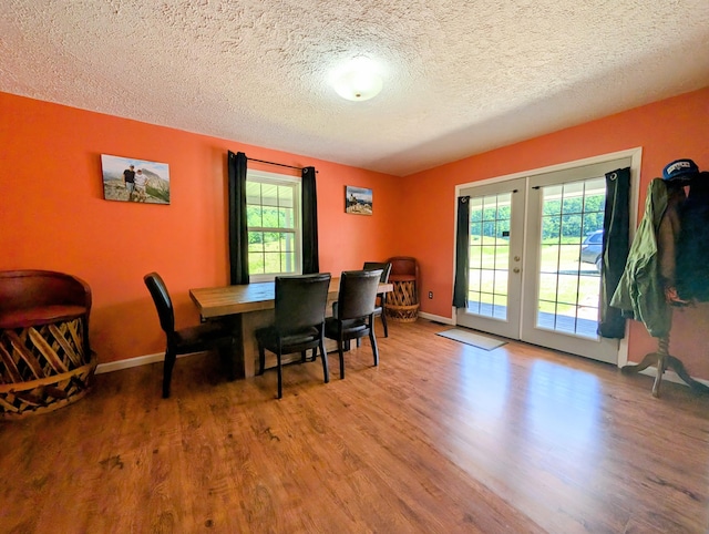 1260 Old Way Rd, London, KY 40741 - dining space with french doors, wood finished floors, and a textured ceiling