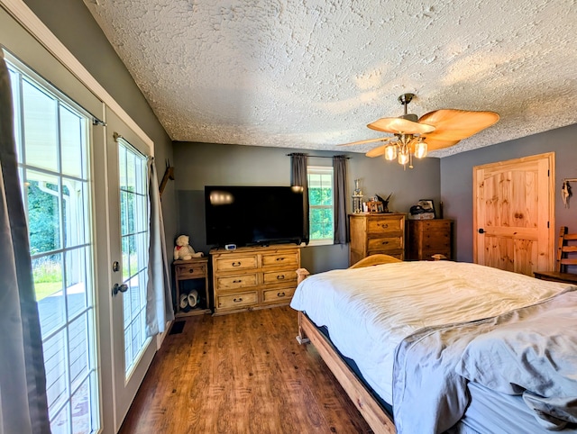 1260 Old Way Rd, London, KY 40741 - bedroom featuring wood finished floors, access to exterior, a textured ceiling, and ceiling fan