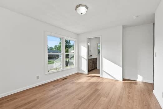 1142 Kiowa Trl, Frankfort, KY 40601 - unfurnished living room with light wood finished floors and baseboards
