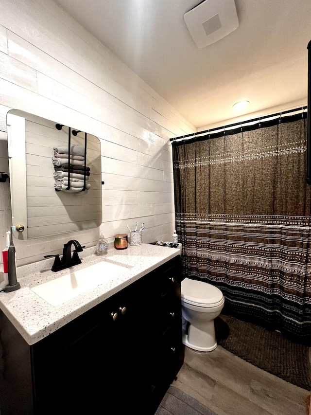 525 Scenic Dr, Harrodsburg, KY 40330 - bathroom with vanity, wood finished floors, wood walls, and a shower with curtain