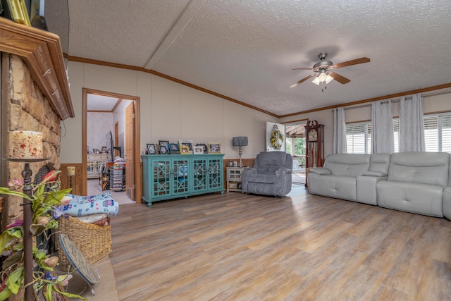 494 Janice Ln, Owingsville, KY 40360 - living room featuring vaulted ceiling, crown molding, a textured ceiling, a ceiling fan, and healthy amount of natural light