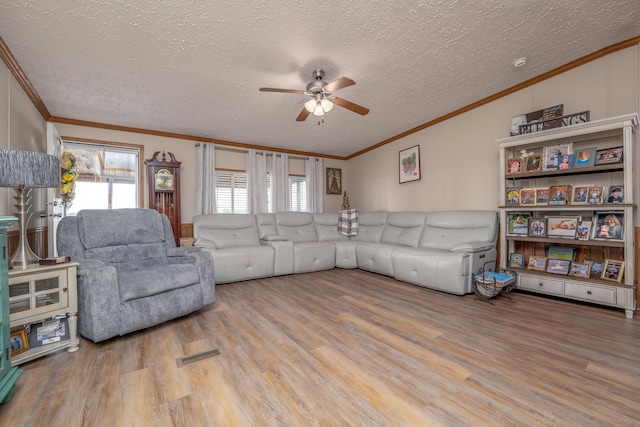 494 Janice Ln, Owingsville, KY 40360 - living room featuring ornamental molding, wood finished floors, a ceiling fan, and a textured ceiling