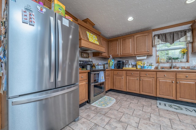 494 Janice Ln, Owingsville, KY 40360 - kitchen with appliances with stainless steel finishes, brown cabinetry, a textured ceiling, and recessed lighting